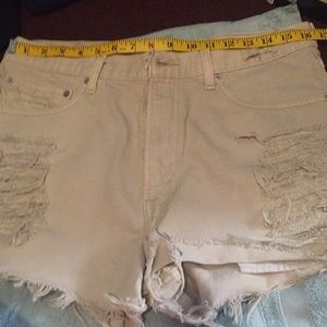 Levi’s tan denim distressed cut-off shorts